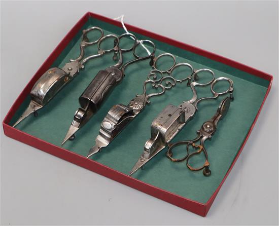 Five pairs of early 19th century steel candle snuffers,